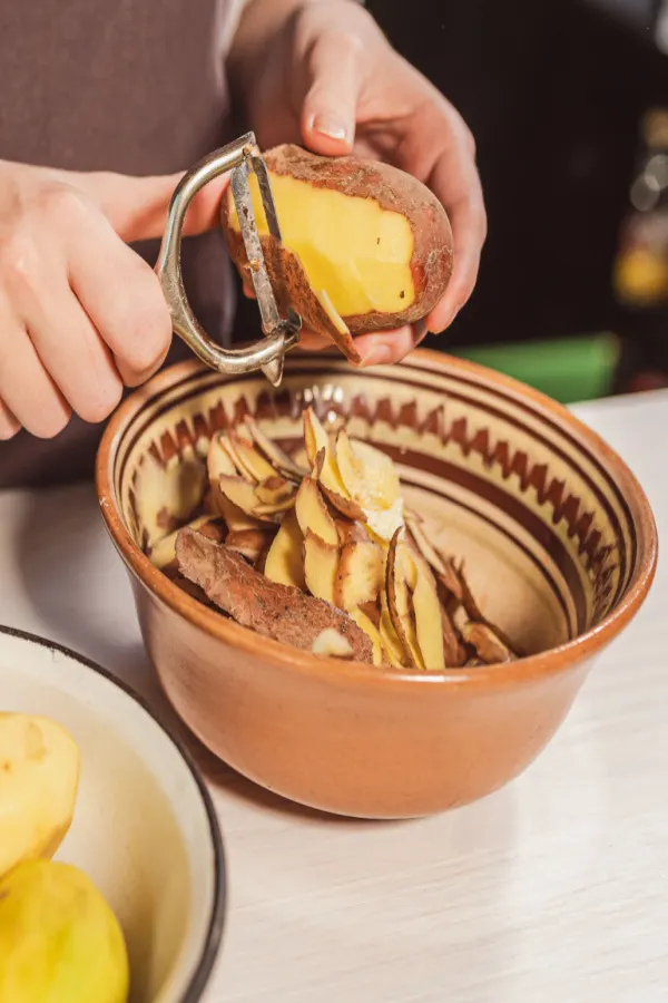 adding vegetable peels